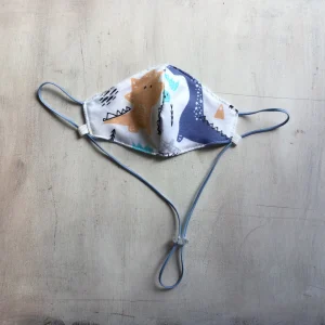 Tapaboca Reversible Anatómico con tira para colgar y regulador - Tricapa Dinosaurios
